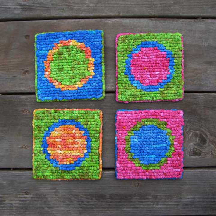 5”x5” - Design by Theresa PulidoFeatured in the “Hook, Loop, & Lock” book. Made with batik fabric strips - 5-mesh canvas.