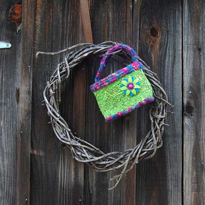 7”W x 3 ½”D x 5 ½”W - Design by Theresa PulidoFeatured in the “Hook, Loop, & Lock” book. Made with batik fabric strips, bulky novelty yarn, felt embellishments - 5-mesh canvas.