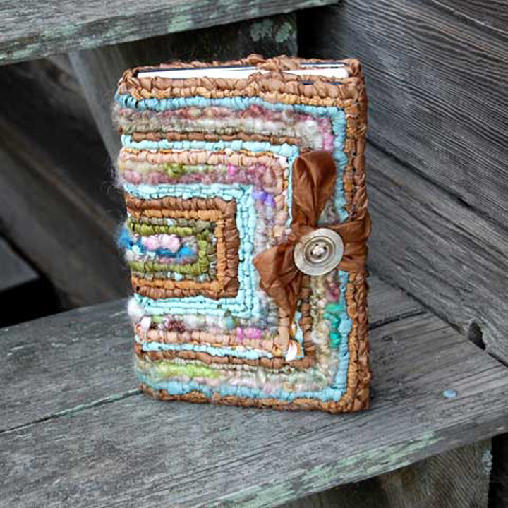 Design by Cathren BrittFeatured in the “Hook, Loop, & Lock” book. Made with shimmering ribbons, yarns, and fabric strips, button and ribbon closure - 5-mesh canvas.